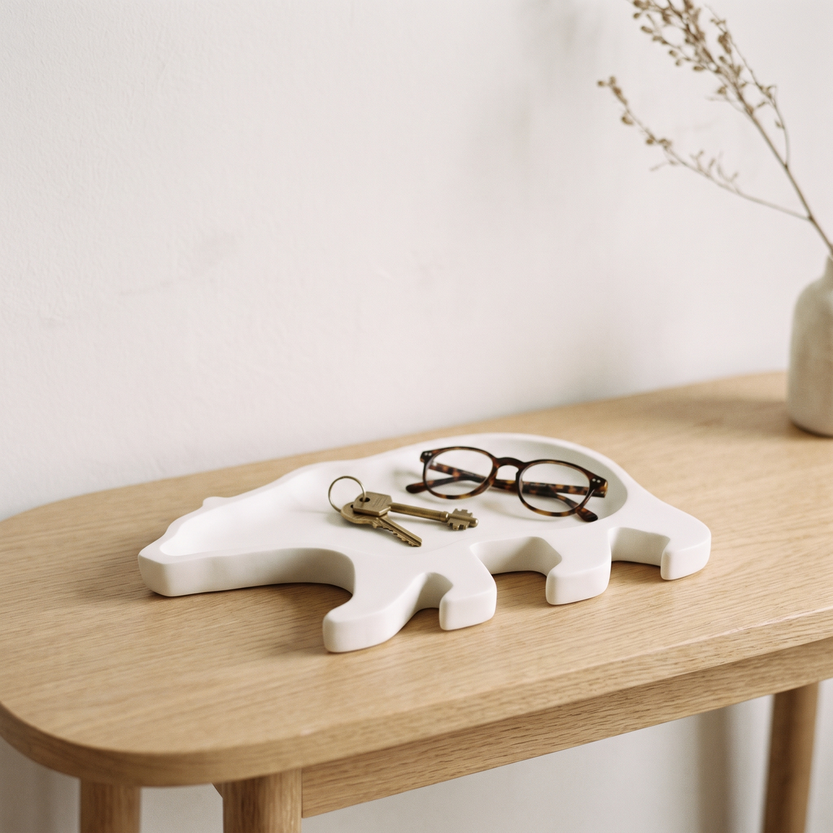 Minimalist polar bear tray on a pale oak console