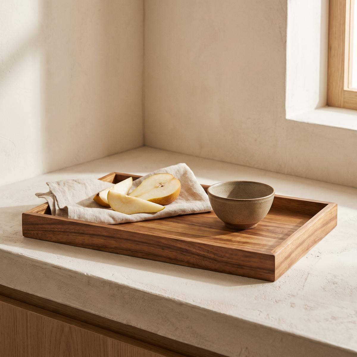 Acacia wood serving tray styled on a kitchen counter
