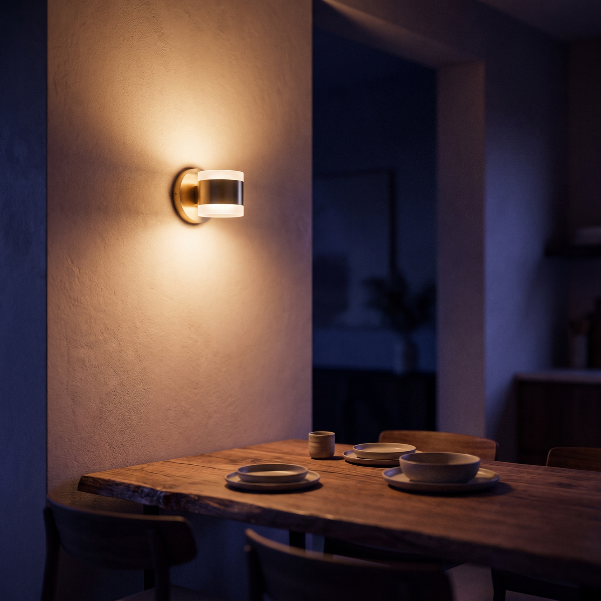 LED wall sconce above a dining table